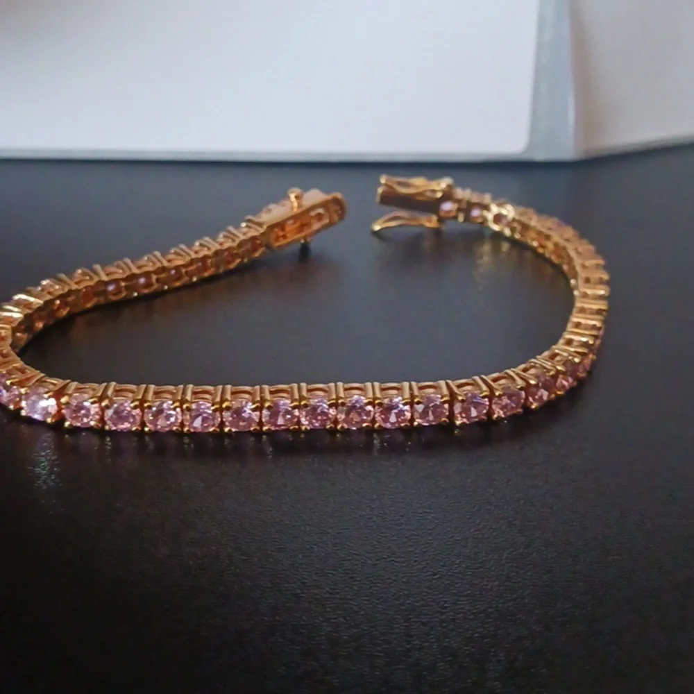 Elegant Gold Tone Bracelet with Pink Stones